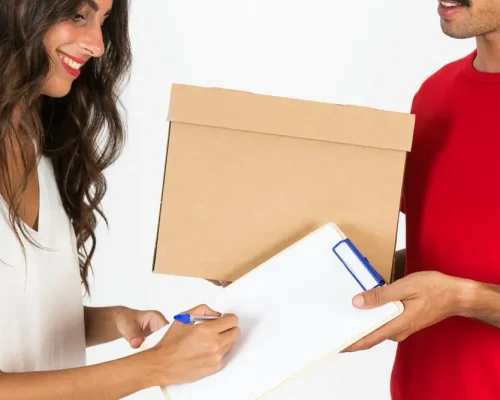 young-deliveryman-with-box young-deliveryman-with-box